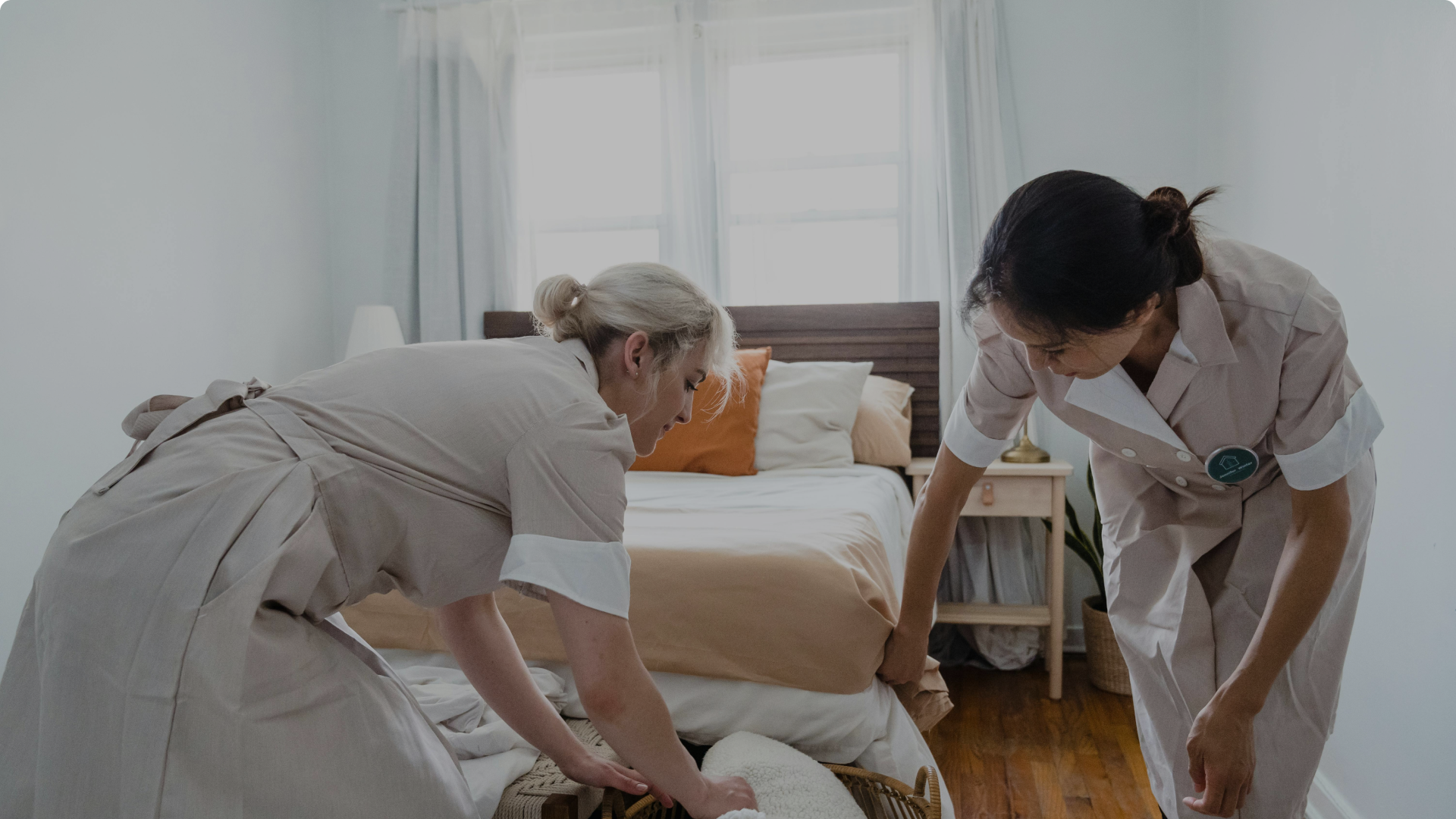 women cleaning a bedroom