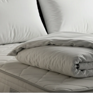 a close up of a white bed