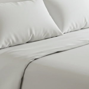 a close up of a white bed
