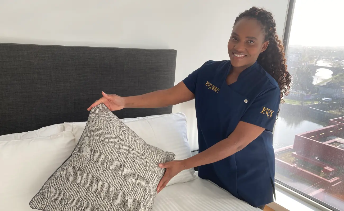 A PRS Cleaner holding a pillow
