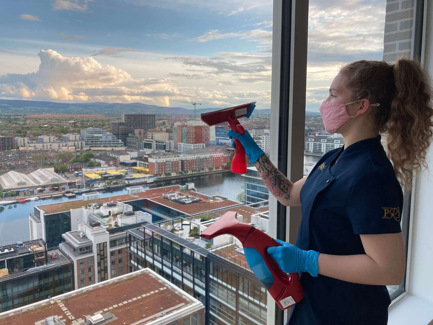 woman cleaning the window