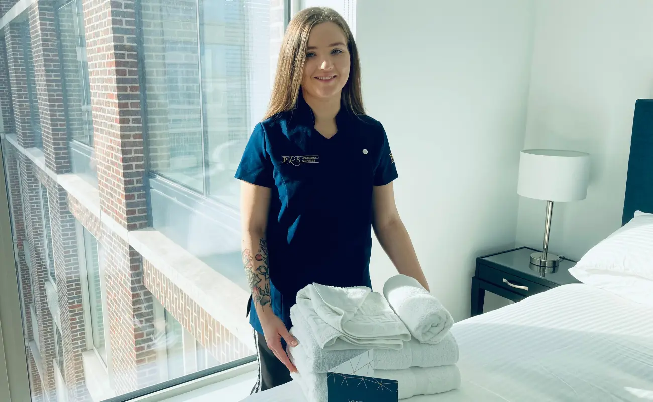 A PRS cleaner holding towels